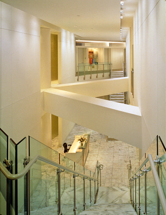 Second Floor View of Two-Story Reception Area with Offices in Background