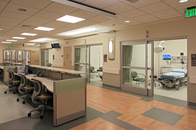 Urgent Care Corridor with View of Patient Rooms and Nurse Stations